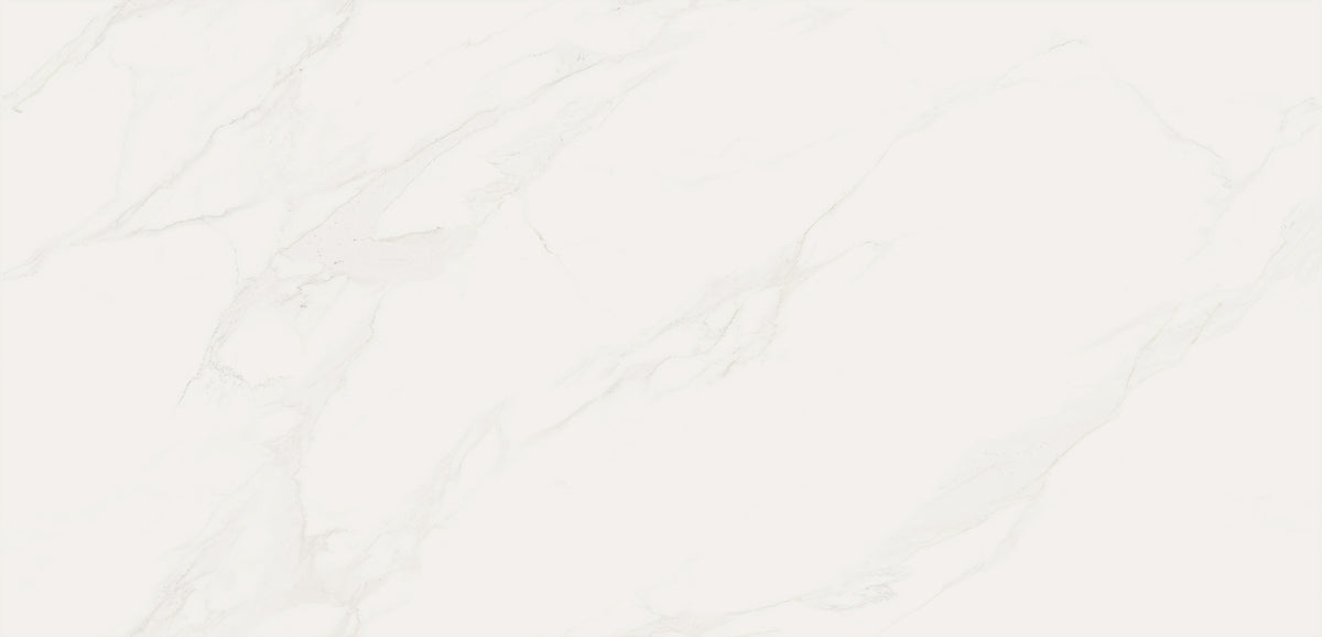 A close-up of a light warm off-white marble or quartz surface with soft beige and gray veining across the full frame.